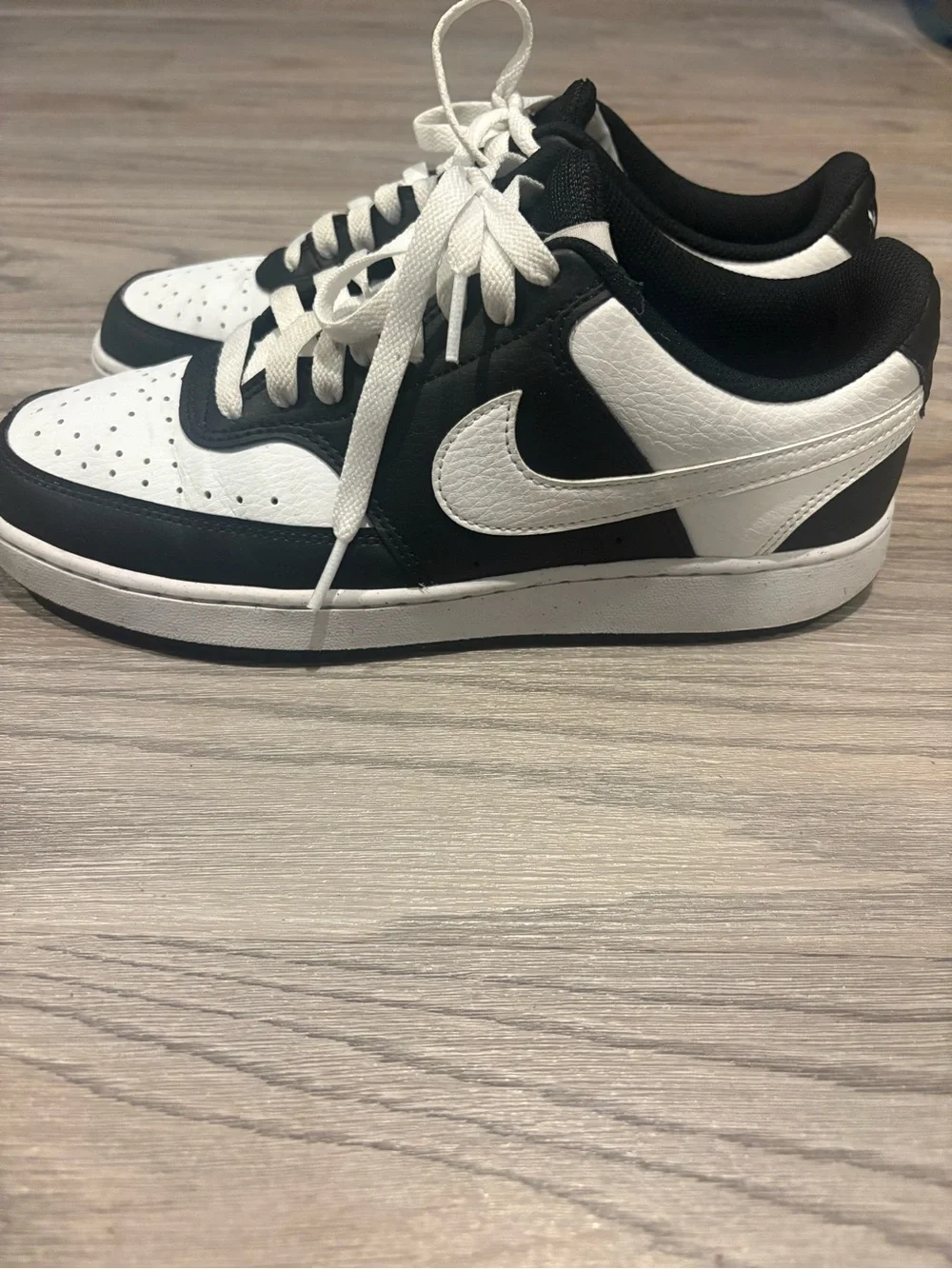 Nike Women’s Black and White Low-Top Sneakers with White Swoosh